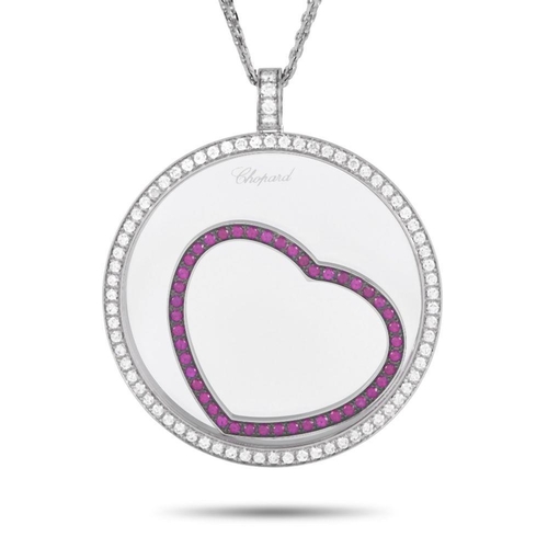 135 - A Chopard Happy Diamonds 18K White Gold 1.31ct Diamond and Ruby Necklace. Suspended from a 23 chain,... 