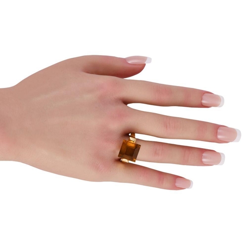 508 - A Gucci Chiodo 18K Yellow Gold Citrine Ring. 18K yellow gold angular band with oversized step-cut ci... 