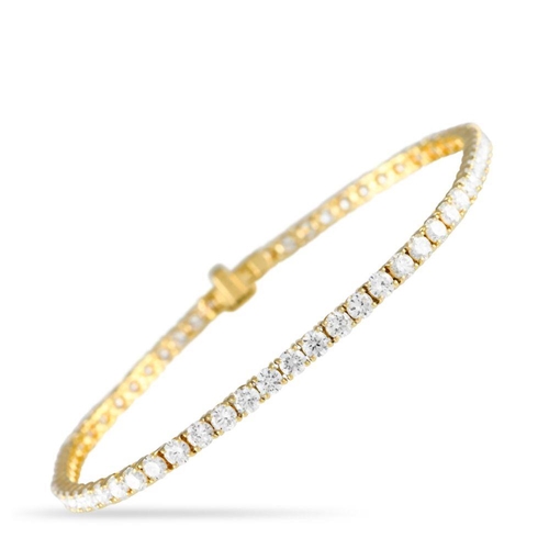 556 - A 14K Yellow Gold 5.20ct Lab-Grown Diamond Tennis Bracelet. Features a single line of 63 round brill... 