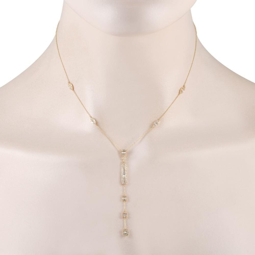 563 - A 14K Yellow Gold 0.90ct Diamond Necklace. Five diamond clusters - four in marquise-shaped frames an... 