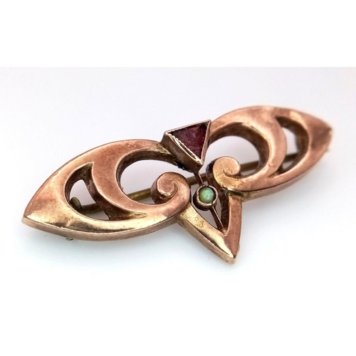 1822 - An Antique Rose 9K Gold, Garnet and Turquoise Brooch. Pin has been replaced. 3.5cm. 1.85g total weig... 