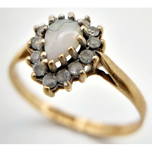 127 - A 9K GOLD RING WITH CENTRAL OPAL STONE SURROUNDED BY DIAMONDS (1 stone missing)  1.6gms    size P