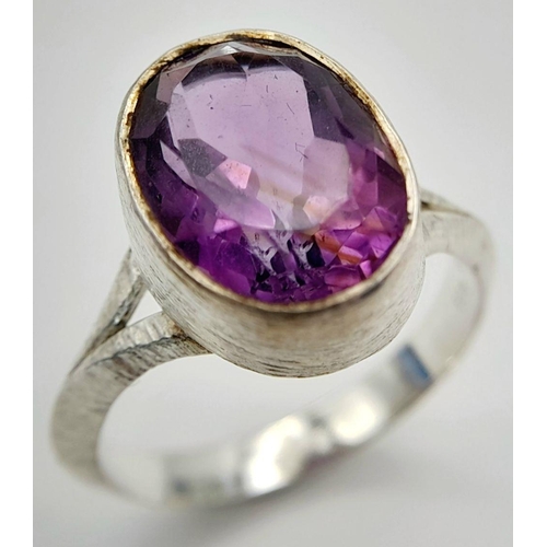 886 - A Sterling Silver Bark Pattern Amethyst Set Ring Size U. Set with a 1.4cm Long Faceted Amethyst the ... 