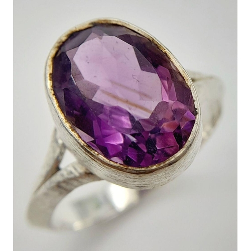 886 - A Sterling Silver Bark Pattern Amethyst Set Ring Size U. Set with a 1.4cm Long Faceted Amethyst the ... 