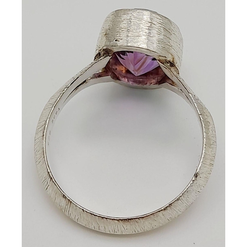 886 - A Sterling Silver Bark Pattern Amethyst Set Ring Size U. Set with a 1.4cm Long Faceted Amethyst the ... 