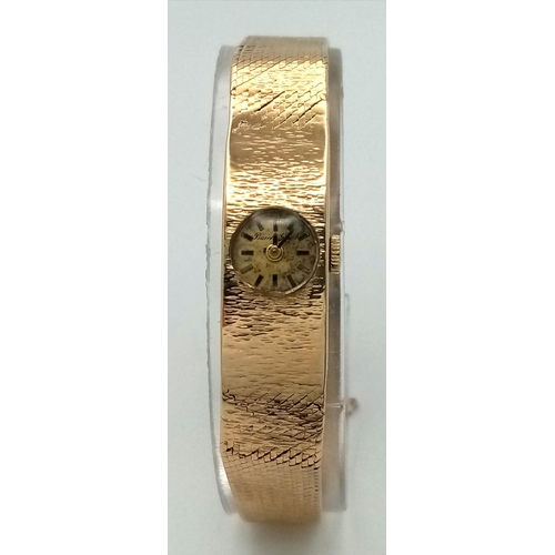 15 - A Vintage 9k Gold Accurist Ladies Watch. 9k gold bracelet and case - 10.5mm. Patinaed dial. 17 Jewel... 