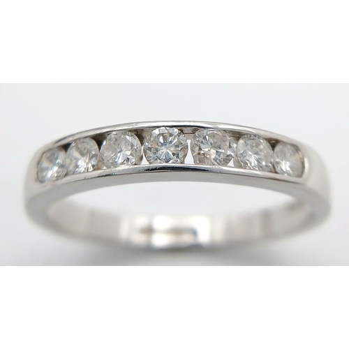 186 - AN 18K WHITE GOLD DIAMOND HALF ETERNITY RING - 0.50CTW. 3.1G. SIZE R. JR12.