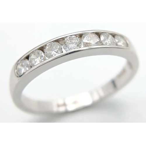 186 - AN 18K WHITE GOLD DIAMOND HALF ETERNITY RING - 0.50CTW. 3.1G. SIZE R. JR12.