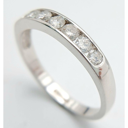 186 - AN 18K WHITE GOLD DIAMOND HALF ETERNITY RING - 0.50CTW. 3.1G. SIZE R. JR12.