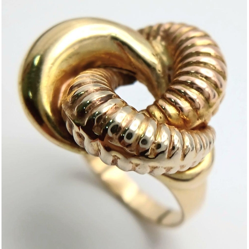 19 - A 18K YELLOW GOLD LARGE KNOT RING 2.3CM X 2.3CM HEAD 8.3G. RING SIZE Q 1/2. REF: SH1605I