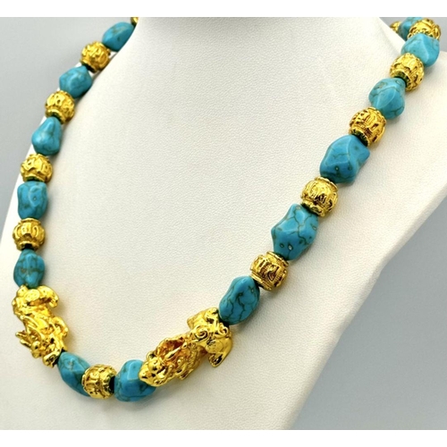 283 - A Chinese turquoise coloured necklace and earrings set with gold plated “pixious” and “good luck” be... 