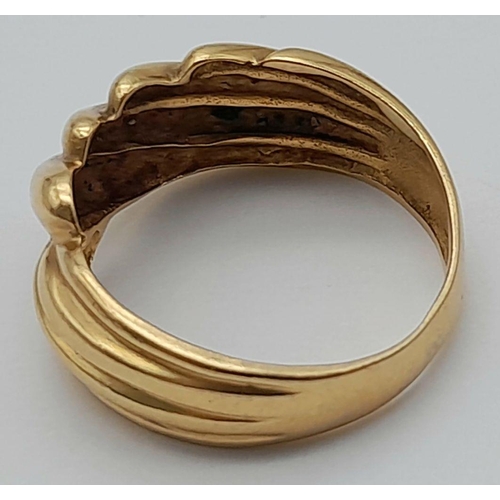 303 - A 18K YELLOW GOLD TESTED AS CROSSOVER WIDE BAND RING, SIZE Q, 4.8G. REF: TC12