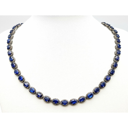 1228 - A 25ctw Kyanite Gemstone Tennis Necklace with Diamond Accents. 4ctw of old cut diamonds. Set in 925 ... 