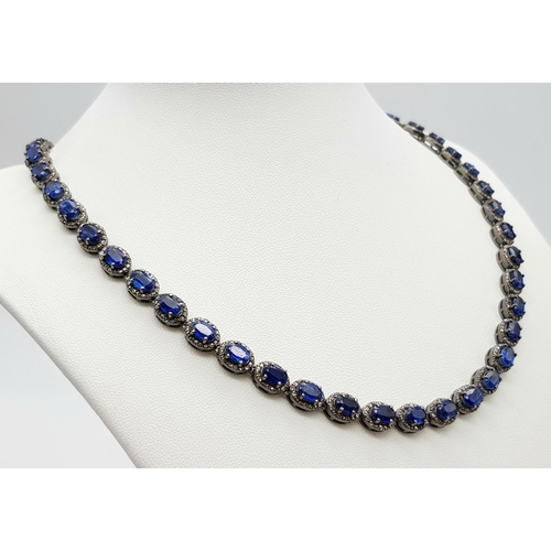 1228 - A 25ctw Kyanite Gemstone Tennis Necklace with Diamond Accents. 4ctw of old cut diamonds. Set in 925 ... 