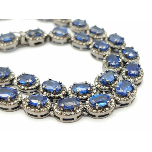 1228 - A 25ctw Kyanite Gemstone Tennis Necklace with Diamond Accents. 4ctw of old cut diamonds. Set in 925 ... 