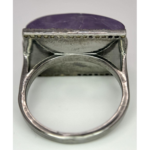 1621 - A Sterling Silver Amethyst Ring with Rose cut diamonds. Rectangular step cut. 14cts. Total weight: 7... 