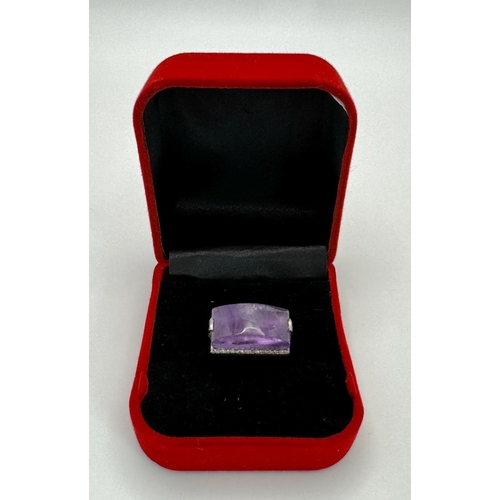 1621 - A Sterling Silver Amethyst Ring with Rose cut diamonds. Rectangular step cut. 14cts. Total weight: 7... 