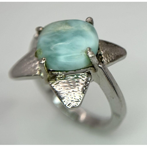 1864 - A Turquoise Cabochon 925 Silver Floral Ring. Size O. Weight - 6.6g. HV2303