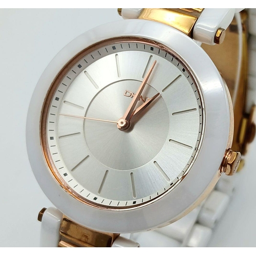 1147 - A Ladies Gold Tone and Ceramic Quartz Watch by DKNY. 36mm Case. New Battery Fitted October 2024.