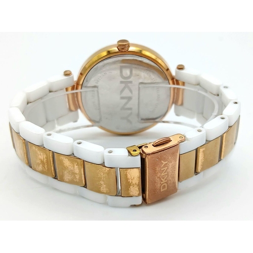 1147 - A Ladies Gold Tone and Ceramic Quartz Watch by DKNY. 36mm Case. New Battery Fitted October 2024.