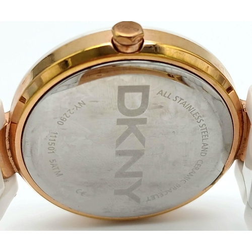 1147 - A Ladies Gold Tone and Ceramic Quartz Watch by DKNY. 36mm Case. New Battery Fitted October 2024.