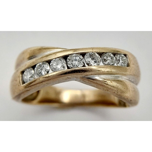 130 - AN 18K WHITE GOLD DIAMOND CROSSOVER RING - 0.33CTW. 4.2G. SIZE K. SPEN6004