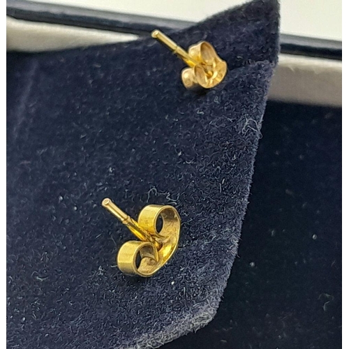 196 - A classic pair of 9 carat GOLD HORSESHOE STUD EARRINGS. complete with quality jewellers earring box.... 