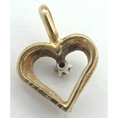 245 - A petite and delicate 9 carat GOLD HEART PENDANT with DIAMOND set to centre. 1.5 cm x 1.2 cm. 1.0 gr... 