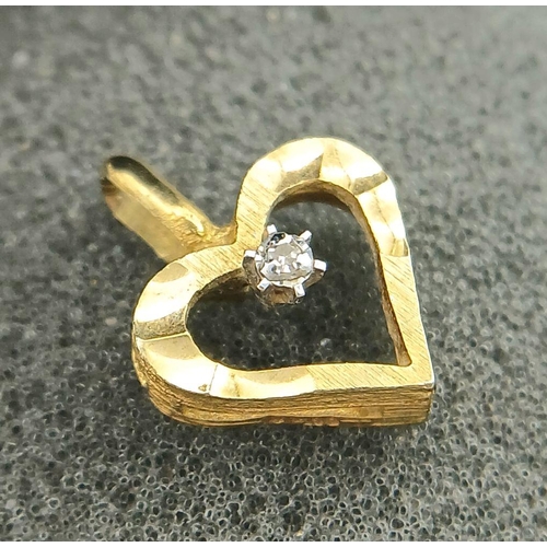 245 - A petite and delicate 9 carat GOLD HEART PENDANT with DIAMOND set to centre. 1.5 cm x 1.2 cm. 1.0 gr... 