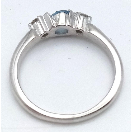 39 - AN 18K WHITE GOLD DIAMOND AND AQUAMARINE RING. 4.1G. SIZE O. AQUA HAS SLIGHT DAMAGE ON EDGE OF STONE... 