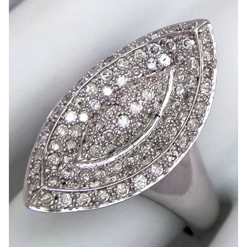 395 - A 14K WHITE GOLD DIAMOND SET RING. MARQUISE SHAPE WITH PAVE DECORATION. 1CTW 8.8G. SIZE T. TAN6011