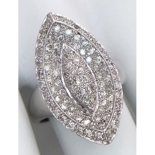 395 - A 14K WHITE GOLD DIAMOND SET RING. MARQUISE SHAPE WITH PAVE DECORATION. 1CTW 8.8G. SIZE T. TAN6011