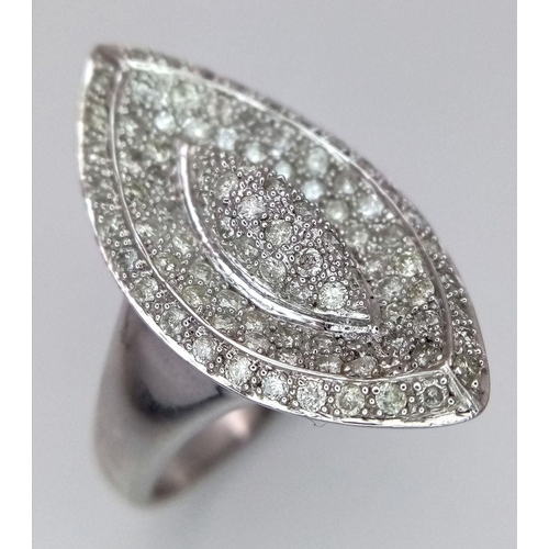 395 - A 14K WHITE GOLD DIAMOND SET RING. MARQUISE SHAPE WITH PAVE DECORATION. 1CTW 8.8G. SIZE T. TAN6011