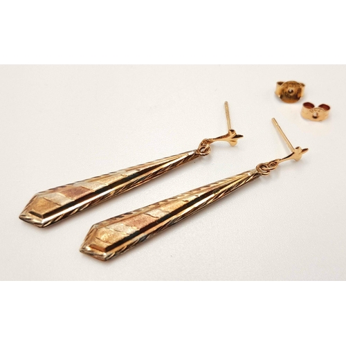 42 - A beautiful pair of Tricolour 9 CARAT GOLD EARRINGS. Baton Drop Style complete with Gold Backs. Pres... 