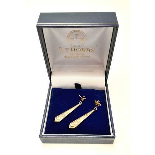 42 - A beautiful pair of Tricolour 9 CARAT GOLD EARRINGS. Baton Drop Style complete with Gold Backs. Pres... 