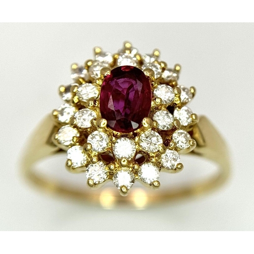 423 - AN 18K YELLOW GOLD DIAMOND AND RUBY CLUSTER RING - 0.40CTW DIAMONDS AND 0.50CT OVAL RUBY. 4.7G. SIZE... 