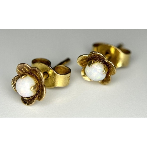 427 - Discreet and Sophisticated pair of 9 carat GOLD, WHITE FIRE OPAL STUD EARRINGS. Complete with Gold b... 