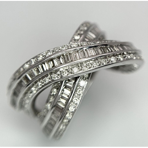 5 - A 14K WHITE GOLD DIAMOND THREE ROW CROSSOVER RING  - COMBO OF ROUND AND BAGUETTE CUT DIAMONDS - 2CTW... 