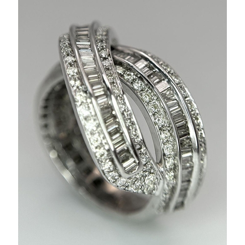 5 - A 14K WHITE GOLD DIAMOND THREE ROW CROSSOVER RING  - COMBO OF ROUND AND BAGUETTE CUT DIAMONDS - 2CTW... 