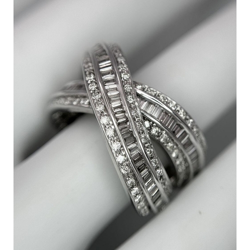 5 - A 14K WHITE GOLD DIAMOND THREE ROW CROSSOVER RING  - COMBO OF ROUND AND BAGUETTE CUT DIAMONDS - 2CTW... 