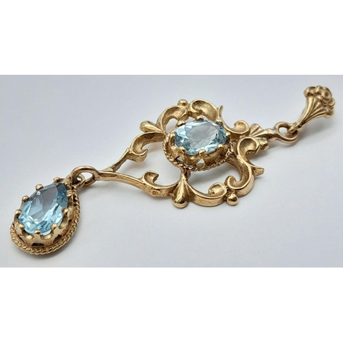 56 - A stunning Edwardian 9 carat GOLD PENDANT set WITH OVAL and PEAR CUT SWISS BLUE TOPAZ GEMSTONES. Pre... 