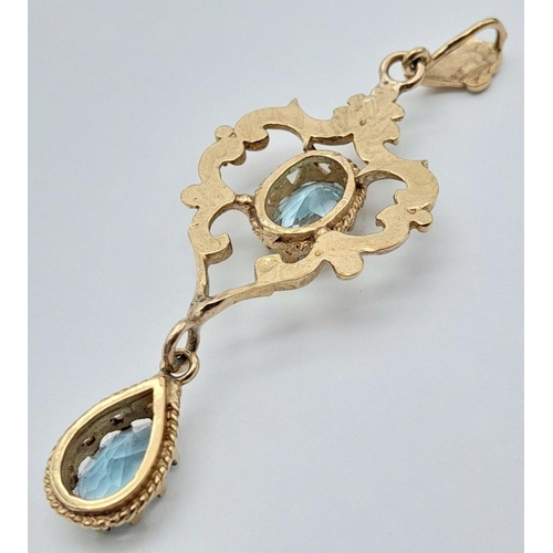 56 - A stunning Edwardian 9 carat GOLD PENDANT set WITH OVAL and PEAR CUT SWISS BLUE TOPAZ GEMSTONES. Pre... 