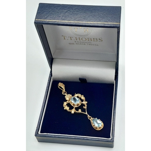 56 - A stunning Edwardian 9 carat GOLD PENDANT set WITH OVAL and PEAR CUT SWISS BLUE TOPAZ GEMSTONES. Pre... 