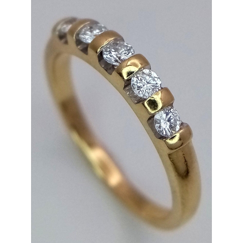 598 - AN 18K YELLOW GOLD DIAMOND BAND RING - 0.20CT. 2.9G. SIZE M. A/S 1150