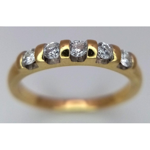 598 - AN 18K YELLOW GOLD DIAMOND BAND RING - 0.20CT. 2.9G. SIZE M. A/S 1150