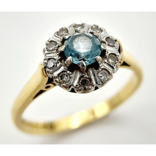 63 - An exceptionally pretty hallmarked 18 CARAT GOLD, AQUAMARINE and DIAMOND RING. Presented in ring box... 