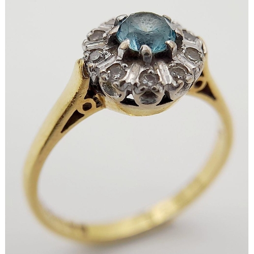 63 - An exceptionally pretty hallmarked 18 CARAT GOLD, AQUAMARINE and DIAMOND RING. Presented in ring box... 