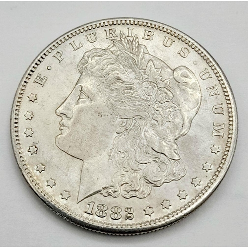 676 - An 1882, San Francisco Mint, Silver Morgan Dollar. About Uncirculated Condition Graded on the Sheldo... 