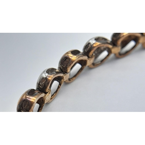 84 - An exquisite 9 carat GOLD TENNIS BRACELET. Consisting WHITE and BRONZE GOLD LINKS  in heart form, ea... 