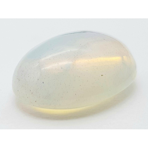 1551 - A 5.70ct Untreated Ethiopian Opal Gemstone - Oval Cabochon Shape, White with Play of Colour. Comes w... 